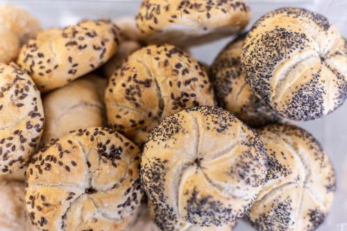 a pile of bagels covered in sesame at Park Hotel in Rimini