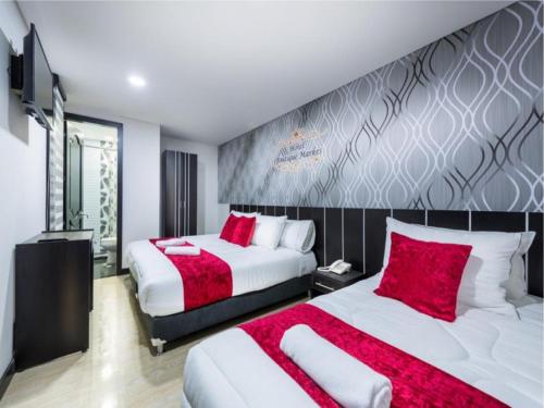 Tempat tidur dalam kamar di Hotel Boutique Markes