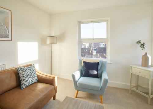 a living room with a couch and a chair at Host & Stay - Osborne House in Whitby