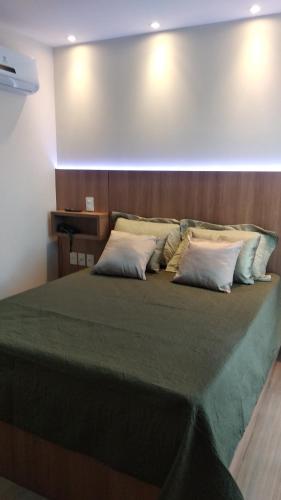 Postel nebo postele na pokoji v ubytování Apart Hotel Pedra Azul