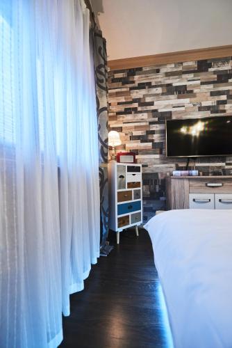 Un ou plusieurs lits dans un hébergement de l'établissement Apartment AlPreMira