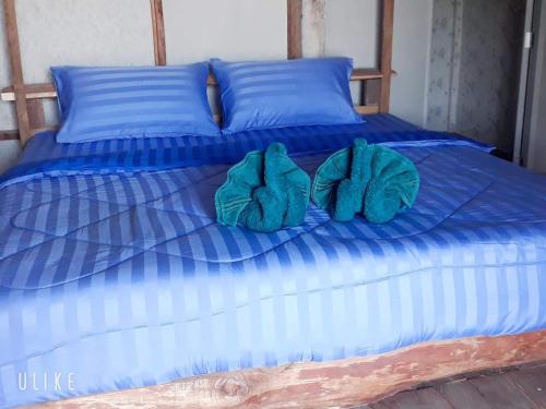 Postel nebo postele na pokoji v ubytování Blue Sky Bungalow
