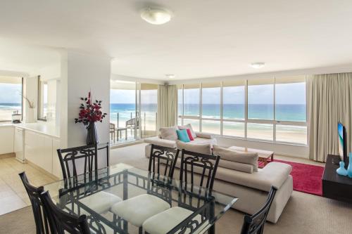 a living room with a view of the ocean at Dorchester On The Beach in Gold Coast