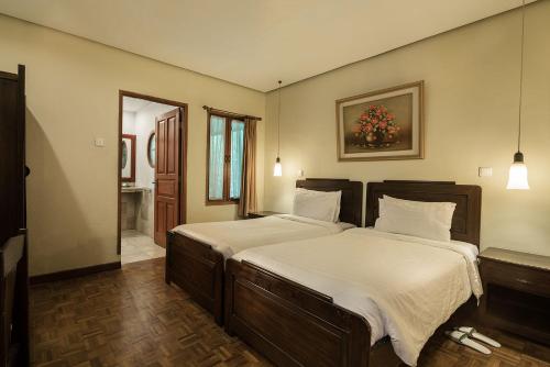 Voodi või voodid majutusasutuse Puncak Pass Resort toas