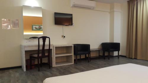 Red Rock Hotel Penangにあるテレビまたはエンターテインメントセンター