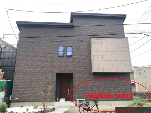 a building with a red sign in front of it at Chie's house in Mitaka
