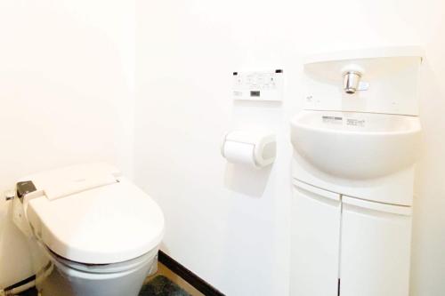 a bathroom with a toilet and a sink at Yahiro 4-chome House 2F,3F in Tokyo