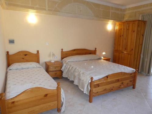 Кровать или кровати в номере San Antonio Guesthouse