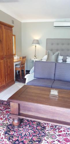 a living room with a bed and a coffee table at Haggards on Hilldrop in Newcastle