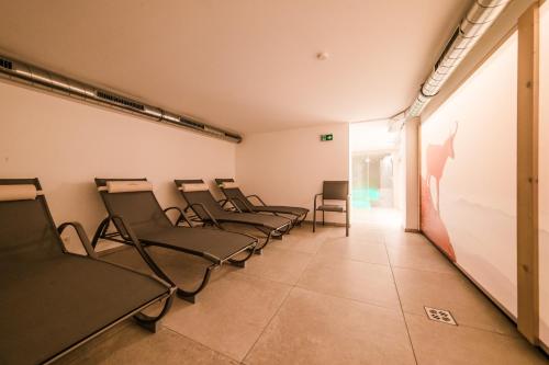 a row of chairs in a waiting room at Hotel Sonnenheim in Sankt Anton am Arlberg