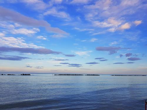 a view of the water with islands in the distance at Marotta, 300 mt dal mare, Sea & City Apartments, Sea&Business, Wi-Fi fibra, parking, 3 camere, 11 letti in Marotta