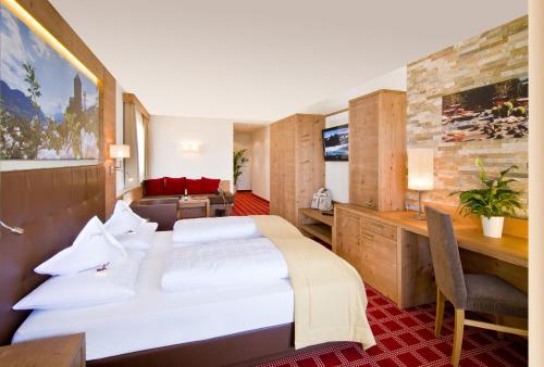 Un pat sau paturi într-o cameră la Alpentirolis