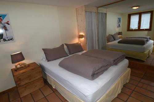 Ένα ή περισσότερα κρεβάτια σε δωμάτιο στο Face Mont-Blanc