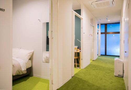 Postel nebo postele na pokoji v ubytování Hostel ilfaro Kurume