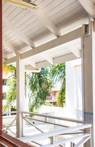 a view from the porch of a building with a wooden roof at Pousada Cristalmar in Bombinhas