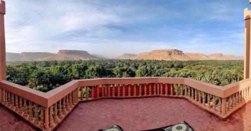 a balcony with a view of the mountains at Maison D'hotes Sahara in Aoufous