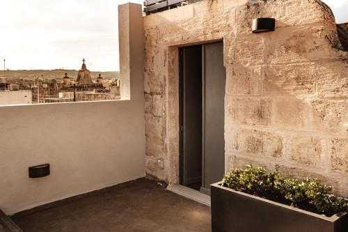 Балкон или терраса в KUCCA Boutique Townhouse