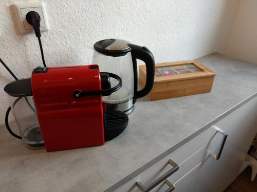 a coffee maker sitting on a counter in a kitchen at Strietpartment - 2 Schlafzimmer, viel Raum und Ruhe in Aschaffenburg