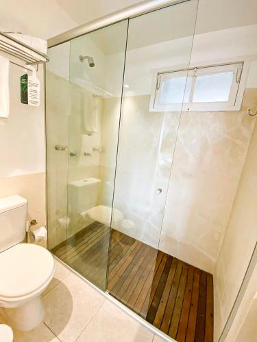 a bathroom with a shower and a toilet at m a r ė a in José Ignacio