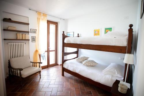 A bed or beds in a room at IseoLakeRental - La Stallina - Monte Isola