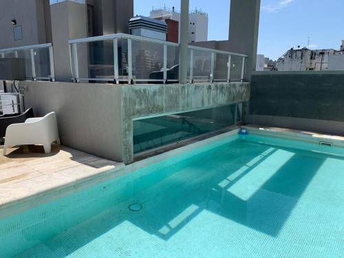 a swimming pool on top of a building at Rent Nuñez 2830 in Buenos Aires