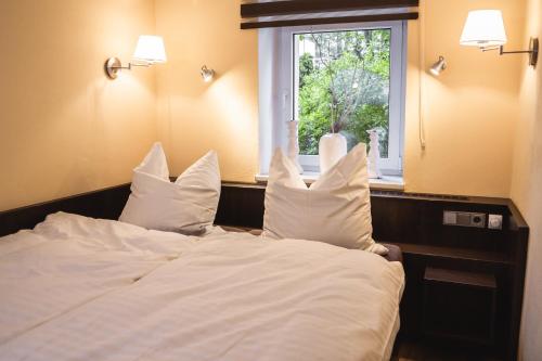 Ένα ή περισσότερα κρεβάτια σε δωμάτιο στο athome IHR Apartment