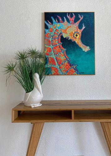 a painting of a dragon on top of a shelf at Sand Castle on the Beach - Adults Only in Frederiksted