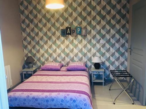Ένα ή περισσότερα κρεβάτια σε δωμάτιο στο Les chambres du roc