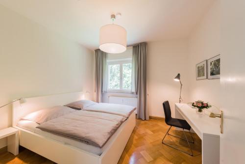 Кровать или кровати в номере Villa Brodthage, App. 4