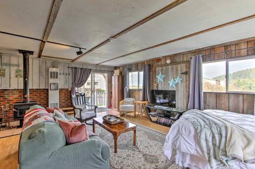 a living room with a bed and a couch at Sandy Toes Loft with Ocean Views in Moclips! in Moclips