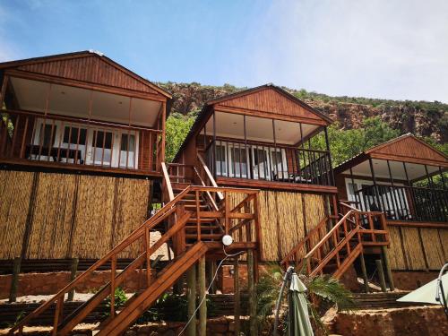 a group of wooden buildings with balconies at Letamong in Hartbeespoort
