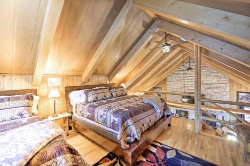 A bed or beds in a room at Centennial Cabin with Hot Tub, Sauna and Pool Table!