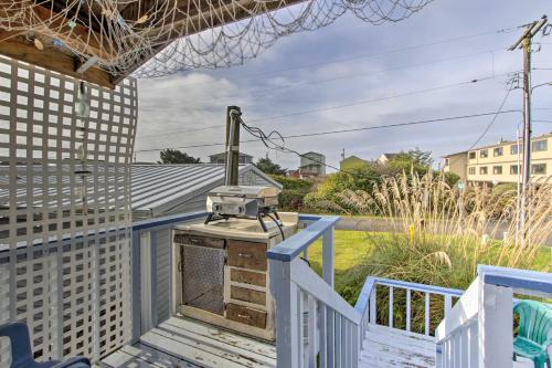 a view from the balcony of a house with a camera at Sandy Toes Loft with Ocean Views in Moclips! in Moclips