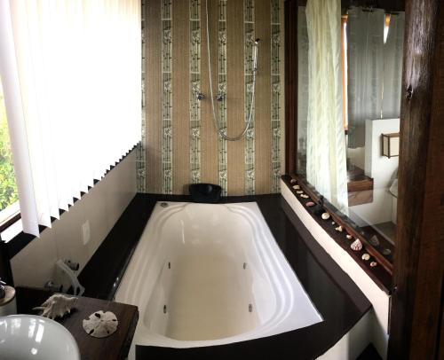 Ảnh trong thư viện ảnh của Casa Jardim Barra De Ibiraquera ở Barra de Ibiraquera