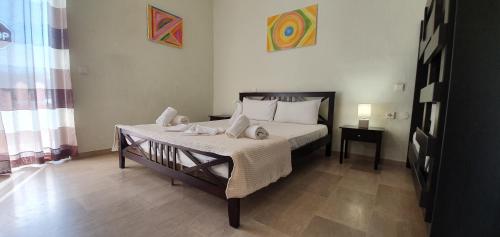 Ένα ή περισσότερα κρεβάτια σε δωμάτιο στο Olympion Melathron Villas