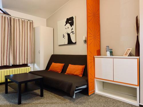a living room with a couch and a table at Apartmany Jasna Chopok in Demanovska Dolina