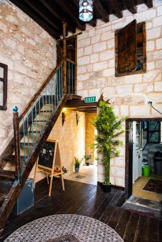 a staircase in a stone building with a stair case at La Casetta in Nazareth