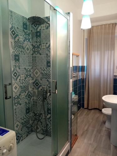 a bathroom with a shower with a toilet and a sink at L'Angolo Di San Pietro in Rome