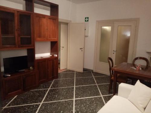 a living room with a couch and a tv and a table at L'Angolo Di San Pietro in Rome
