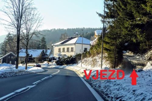 a road with the word ved written on the side of it at Rezidence Kouty in Loučná nad Desnou
