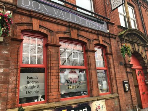 a brick building with windows and a sign on it at Don Valley hotel Sheffield arena in Sheffield