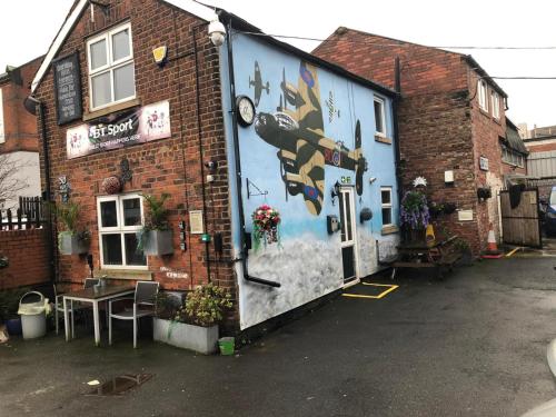 a building with a mural on the side of it at Don Valley hotel Sheffield arena in Sheffield