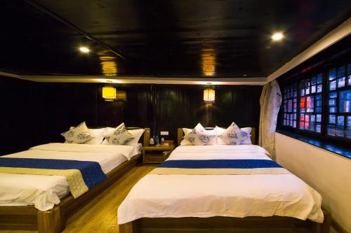 Una cama o camas en una habitación de 一方砚·旅拍体验民宿