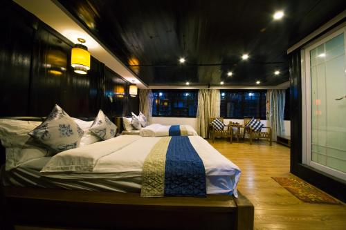 Una cama o camas en una habitación de 一方砚·旅拍体验民宿