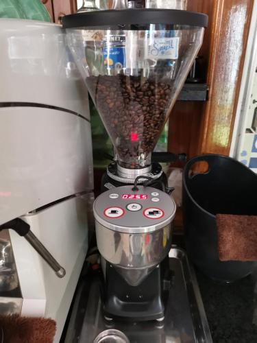 a blender filled with coffee sitting on top of a stove at Poolside Villa in Phnom Penh