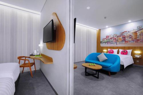 Ένα ή περισσότερα κρεβάτια σε δωμάτιο στο favehotel Ketapang