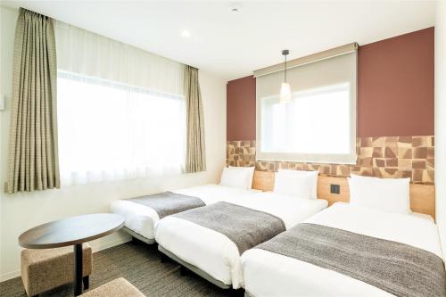 En eller flere senge i et værelse på M's Hotel Sanjo Wakoku