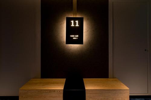a lightswitch on a wall with a wooden table at Hotel Wing International Sapporo Susukino in Sapporo