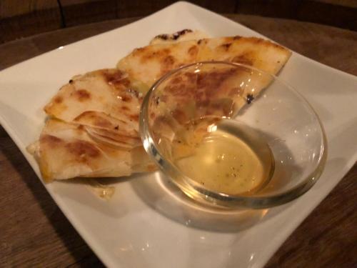 a plate of food with a bowl of dipping sauce at Rantanrirun ランタンリルン in Hakuba