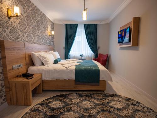 Un pat sau paturi într-o cameră la acar hotel Kırıkkale